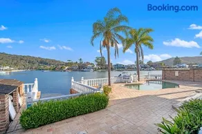 Stunning 4BR Holiday Home with Water Views & Pool - Image 3