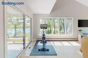 Water-view retreat with beach access, deck, grill, EV charger & lawn games - Image 3