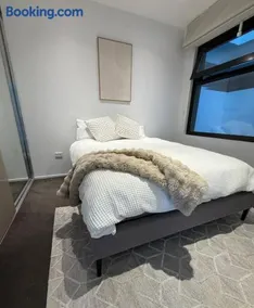 Modern Inner City Resort Near Train with Free Parking and Rooftop Pool - Image 1