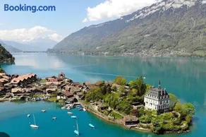 Romantic Swiss Alp Iseltwald with Lake & Mountains - Image 1