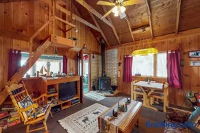 Lakefront cabin with private boat ramp, lake access, wrap-around porch, firepit - Image 2