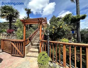 Charming Backyard Guest House with Koi Pond - Image 1