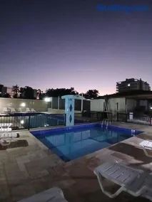Lindo apartamento em frente à praia com piscina - Image 1