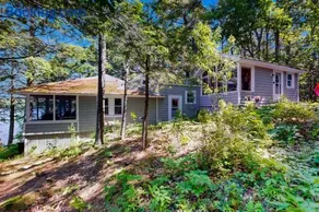 Lakefront cottage with dock, screened porch, & Island in Biscay Pond - Image 1