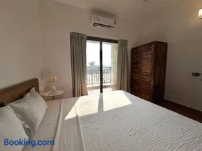 Boutique 1BHK Pool Retreat with Modern Amenities and Private Balcony - Image 3