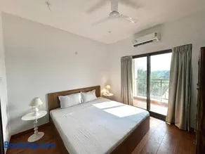 Boutique 1BHK Pool Retreat with Modern Amenities and Private Balcony - Image 2