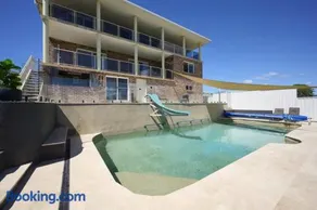 Coastal Retreat with Pool and Balcony Views - Image 1