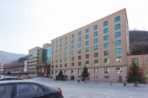 Hele Tongxinyuan Hotel - Image 4