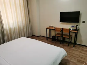Qufu Xueerxing Hotel (East Railway Station Yuandong College) - Image 2