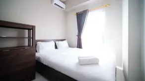 Best Price and Homey 1BR at Tamansari Prospero Sidoarjo Apartment By Travelio - Habitación