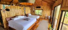 Teak house in a forest above the beach - Camera