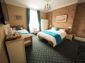 Cowrie Guest House - Chambre