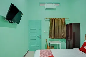 RedDoorz at Orien Guesthouse Pematang Siantar - Chambre