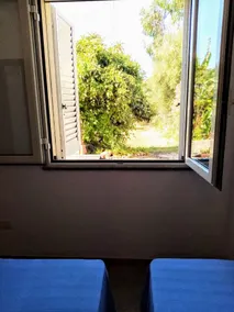 Tertenia rez-de-chaussée sud à 3 min à pied de la mer - Chambre