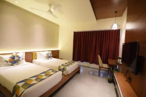 The Pramukh Hotel - Chambre