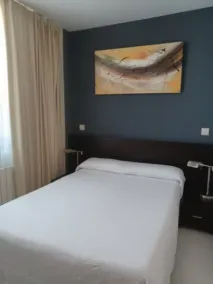 Apartamentos Playa de Portio - Chambre
