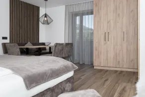 Aparthotel Familiaris - Family Apartments - Pools & Spa in Dolomites - Chambre