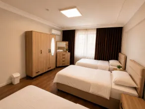 Lumiera Suites Hotel - Habitación