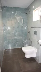 Relax Inn Suites & Rooms - Badezimmer