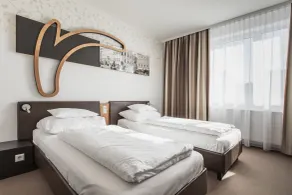 H+ Hotel Ried - Room