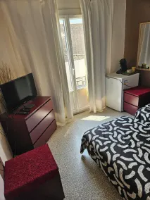 Chambre 2 lit simple avec balcon - Værelse