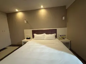 Huayi Hotel - Chambre
