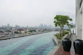 Cozy 2BR Apartment Nine Residence with City View By Travelio - Pool
