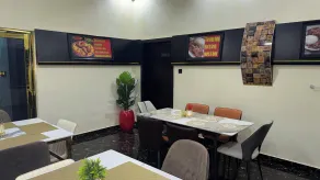 Next Level Hotel & Suites - Restaurant