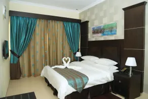 Ivory Grand Hotel Apartments - Chambre