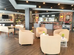Merit Hotel & Suites - Restaurant