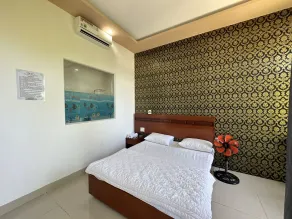OYO 1191 Happy Motel - Quarto