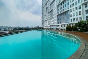 Comfort 1BR at Patraland Urbano Apartment By Travelio - Pool
