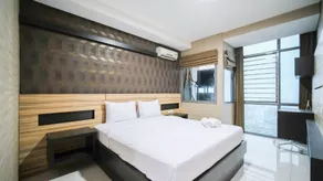 Homey and Cozy Living 2BR Apartment at Aryaduta Residence Surabaya By Travelio - Habitación