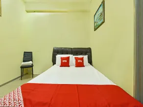 Hotel O Ummul Motel - Zimmer