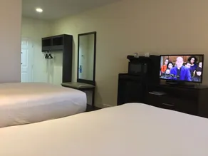 Days Inn & Suites by Wyndham Galveston West/Seawall - Chambre