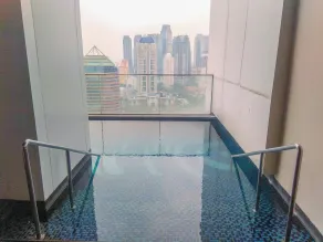 Spacious and Warm 2BR at Ciputra World 2 Apartment By Travelio - Pool