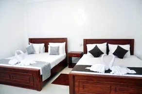 Airport Grand Holiday Home - Zimmer