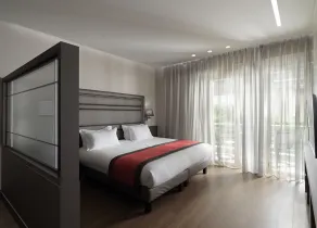 Holiday Suites - Chambre