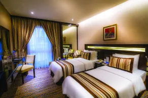 Golden Tulip Bahrain - Zimmer