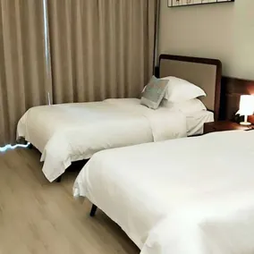 Poltton International Apartment Jinding - Room