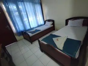 Capital O 93024 Hotel Ganesha - Habitación