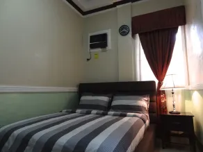 The Executive Villa Inn & Suites - Zimmer