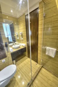 Hotel Delite Grand - Badezimmer