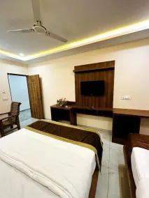 Navarathna Comforts - Chambre
