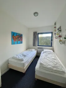 6 personnes Maison Marijke avec jardin d'hiver et accès direct au Lauwersmeer - Chambre