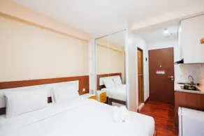 Cozy and Simply Studio Tifolia Apartment near Kelapa Gading By Travelio - Room