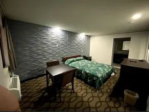 Deluxe Inn - Zimmer