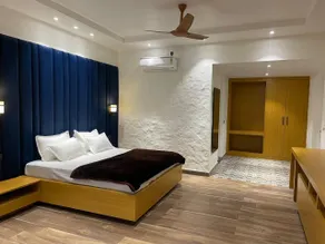 Mangalam Inn By AAA Grand - Habitación