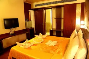 Srinivas Saffron Hotel - Room