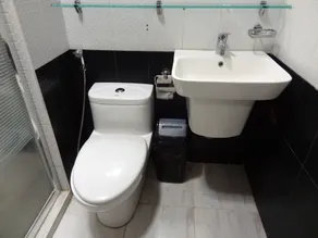 The Executive Villa Inn & Suites - Badezimmer